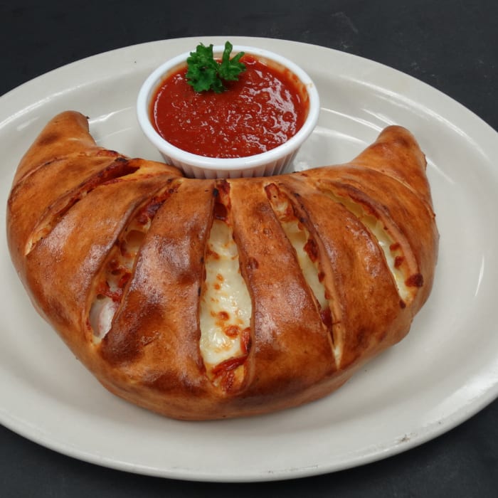 #6 One 2-Topping Calzone, One Sandwich of your Choice & 2 Cans of Soda.
