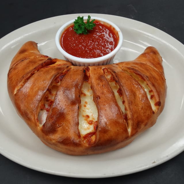 #6 One 2-Topping Calzone, One Sandwich of your Choice & 2 Cans of Soda.